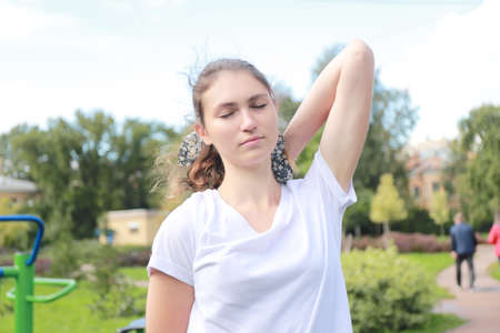 let's keep fit - young girl exercising outdoorsの写真素材
