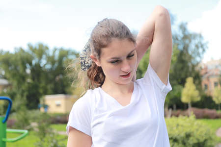 let's keep fit - young girl exercising outdoorsの写真素材