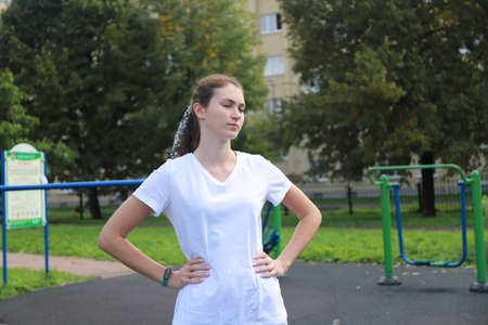 let's keep fit - young girl exercising outdoorsの写真素材