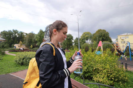 let's keep fit! sports walking with a young girl outdoorsの写真素材
