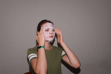 behind the scenes of going on a date - young girl is doing her makeupの写真素材