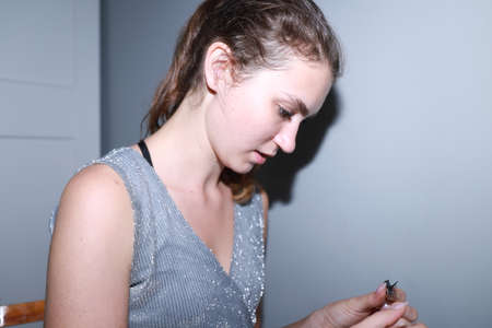 behind the scenes of going on a date - young girl is doing her makeupの写真素材