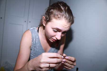 behind the scenes of going on a date - young girl is doing her makeupの写真素材