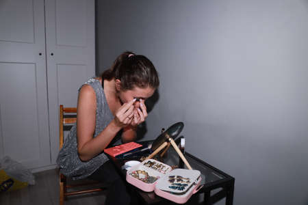 behind the scenes of going on a date - young girl is doing her makeup