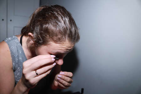 behind the scenes of going on a date - young girl is doing her makeupの写真素材