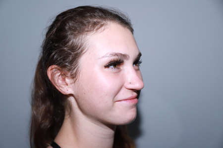 behind the scenes of going on a date - young girl is doing her makeupの写真素材