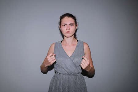 very emotional young girl shows you how to express yourselfの写真素材