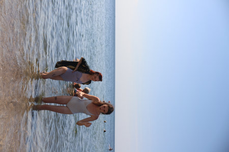 group of friends having fun on the sea beachの写真素材