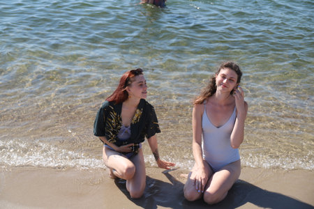 group of friends having fun on the sea beachの写真素材