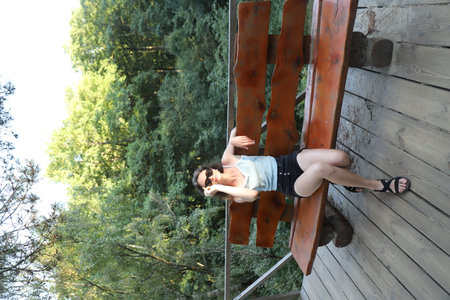 walk along the ecotrail. relaxing on the benchの写真素材