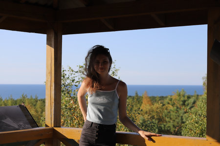 portrait of a young woman on a background of treesの写真素材
