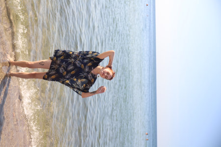 girl in swimsuit walking on the beachの写真素材