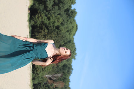 girl in swimsuit walking on the beachの写真素材