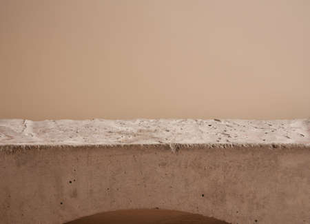 Minimal modern natural stone product display on pastel beige background.の写真素材