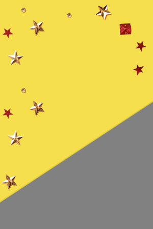 Color of the year 2021 yellow and gray with confetti in the different shapes. High quality photo