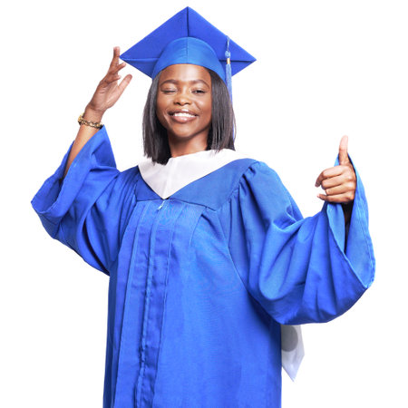 African-American beautiful woman in a blue robe and hat, on a white isolated background smiles, winks and shows thumb upの写真素材