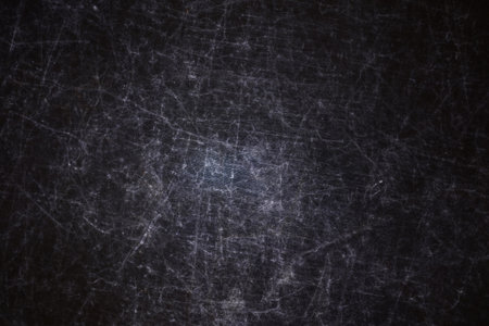 The texture of scratches on fabric on a black background, the texture of a silver reflector in the lightの写真素材