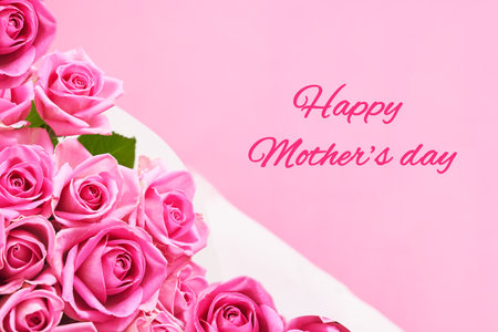 Greeting card with beautiful pink roses with text Happy mother's day. High quality photoの写真素材