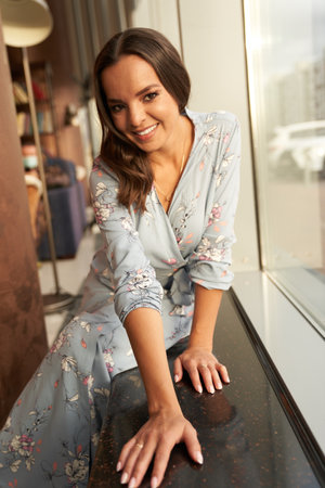 Beautiful young happy woman smiling on the home background with copy space. High quality photoの写真素材