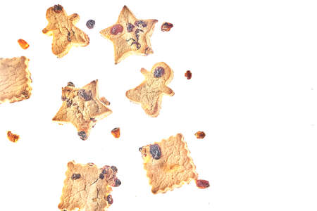 Cookies in different shapes, gluten-free, lactose-free, healthy dessert with dark chocolate and raisins on an isolated white background, levitationの写真素材