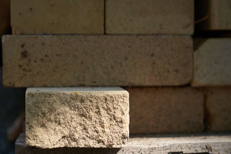 A podium made of rectangular beige stone to demonstrate your product on a stone background. High quality photoの写真素材