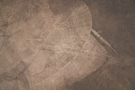 Dark brown seamless concrete texture. Stone wall background. High quality photoの写真素材