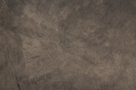 Vintage or rough dark brown background made of natural stone of old texture as a wall with a retro...