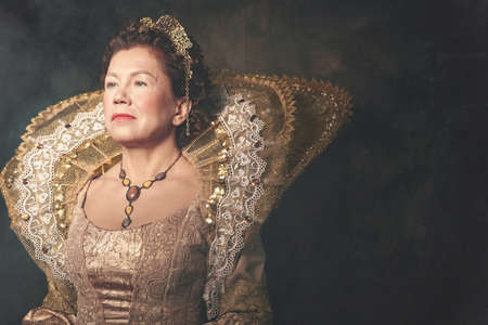 Portrait of the image of Queen Elizabeth I of the 16th century. Historical reconstruction. The image of the queen in smoke on a gray background. High quality photoの写真素材