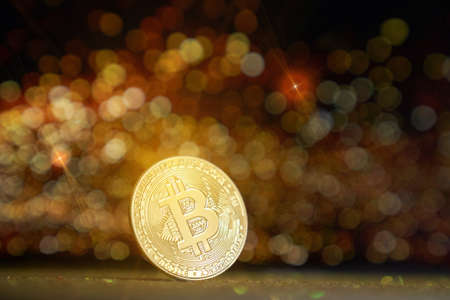 Dark Gold shiny background. The bitcoin cryptocurrency is the coin of the future. Golden Bitcoin. High quality photoの写真素材