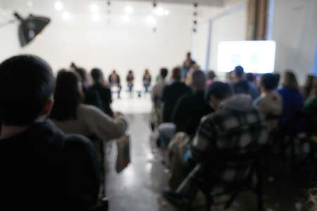 Blurred background of the business conference, a group of people on the stage, presentation of the project, public talk. High quality photoの写真素材