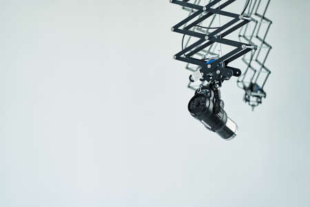 Studio device pulsed light, suspended ceiling system. Flash mount. Technical photo equipment for studios. High quality photoの写真素材