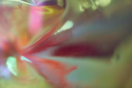 Seamless fashionable iridescent rainbow foil texture. Soft holographic light unicorn pattern in the...