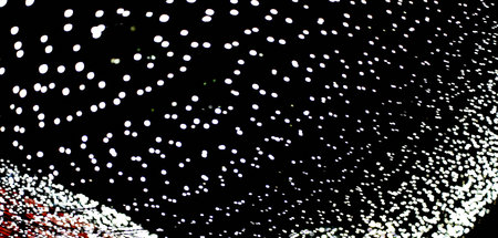 Abstract background in the form of lines of flickering lights with a side of unfocused white lights....