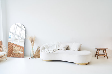 Modern, white minimalist interior. Modern interior design for posters in the living room layout with a white sofa with space to copy. High quality photoの写真素材