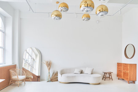 Near the window is a modern, white minimalist interior. Modern interior design for masters in the layout of the living room with a white sofa with the possibility of copying. High quality photoの写真素材