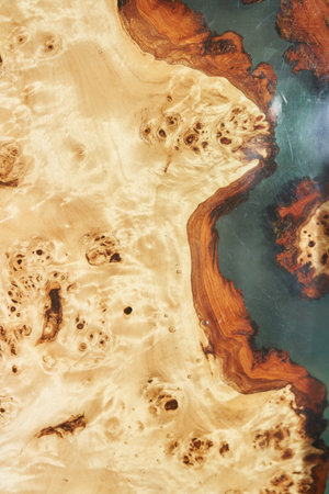Wooden table covered with epoxy resin. Top view of a tree as a background with space to copy. High quality photoの写真素材