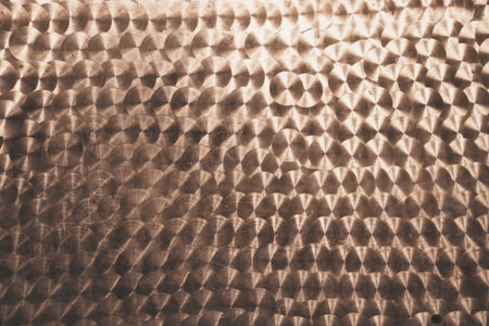 The surface is holographic brown with space for copying. Iridescent film texture. High quality photoの写真素材