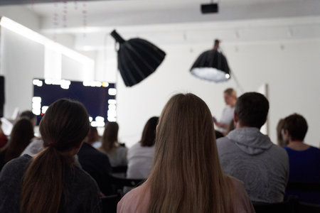 Unrecognizable people in the audience, rear view. Sitting at a lecture or meeting at the university. business and entrepreneurship or the concept of learning. High quality photoの写真素材