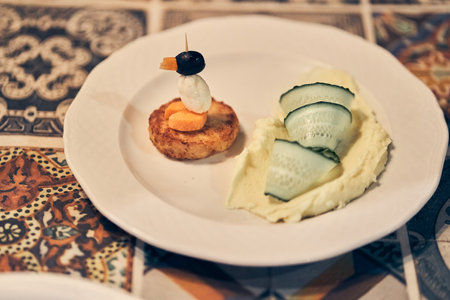 Creative presentation for the kid. The concept of a childrens menu, proper nutrition. Funny ideas for kids, table setting, vegetable penguin. High quality photoの写真素材