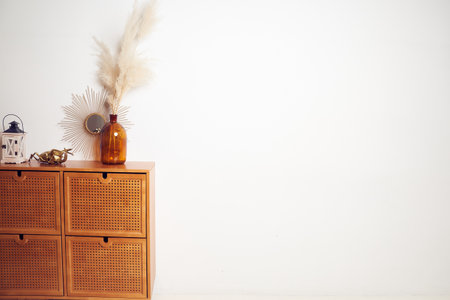 Beautiful mockup, white wall for your poster, bouquet of dried pampas grass flowers in a vase,...