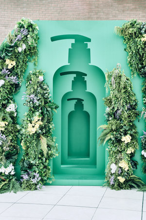 Installation of a hair balm with flowers for product demonstration. Concept: template and background...
