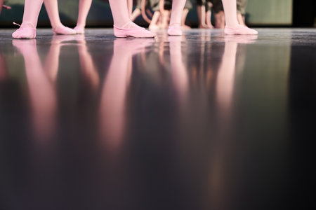 The reflection of childrens feet on the stage. Classic childrens choreography with the possibility...