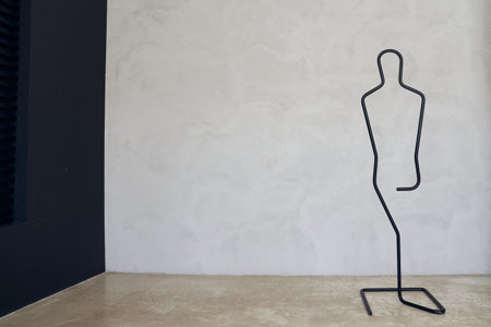 A stand holder for jewelry. A jewelry stand in the shape of a human silhouette. With space to copy, with space for your design, poster. High quality photoの写真素材