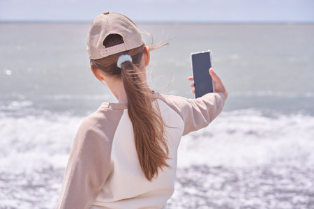A child takes a selfie. Showing off your happy and carefree mood while on vacation against the...