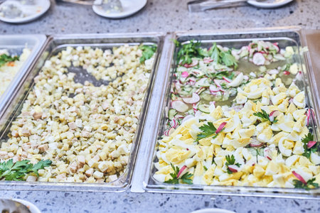 Salad of chopped eggs, fresh vegetables. The restaurant has a delicious and healthy buffet. With...