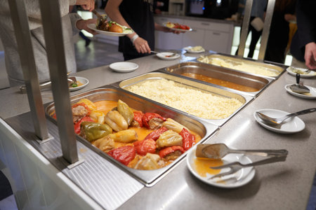 A buffet with Russian dishes, which features traditional dishes in metal containers. With space to copy. High quality photoの写真素材