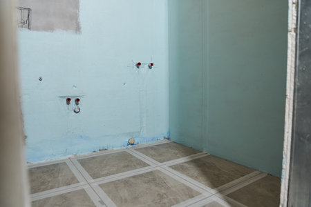 Insulation of wet areas in the bathroom. Insulation and wiring for the socket in the bathroom. With copy space. High quality photoの写真素材