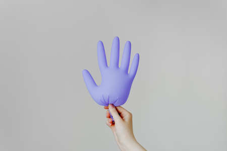 Girl and medical gloves on a white background