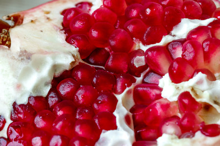 Pomegranate and pomegranate seeds macro photo lightの写真素材
