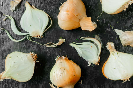 onion on black stone. garlic top view backgroundの写真素材
